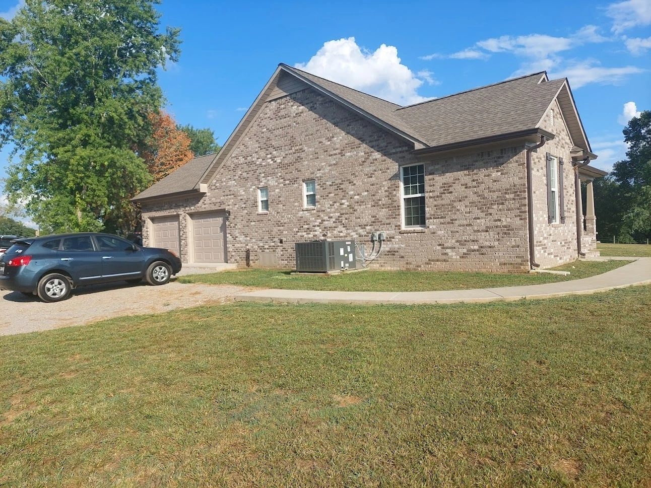 Modern brick residential home front lawn